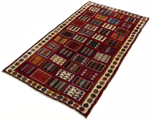 Corner detail of 2000s Shiraz rug showing border pattern and Wool pile