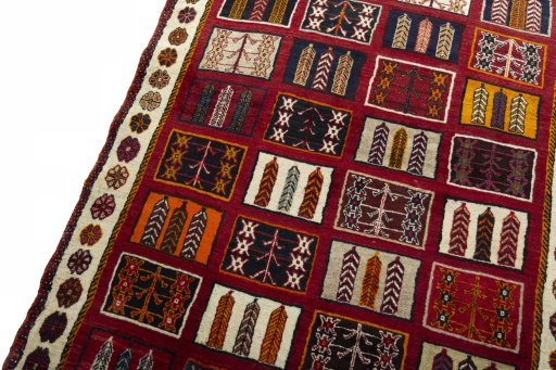 Backside of handmade 2000s Shiraz rug showing knot structure and weave density