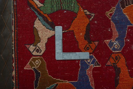 Backside of handmade 2000s Shiraz rug showing knot structure and weave density