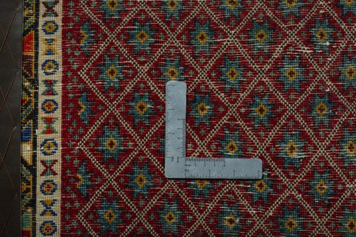 Backside of handmade 2000s Shiraz rug showing knot structure and weave density