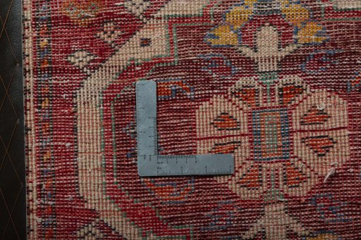 Backside of handmade 2000s Shiraz rug showing knot structure and weave density