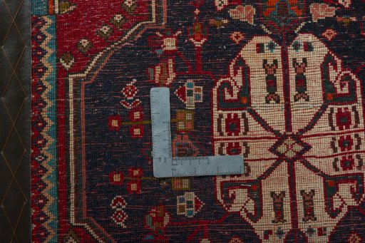 Backside of handmade 2000s Shiraz rug showing knot structure and weave density