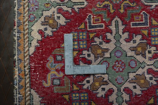 Backside of handmade 2000s Shiraz rug showing knot structure and weave density