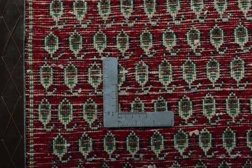 Backside of handmade 2000s Shiraz rug showing knot structure and weave density