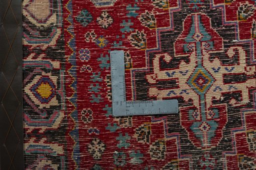 Backside of handmade 2000s Shiraz rug showing knot structure and weave density