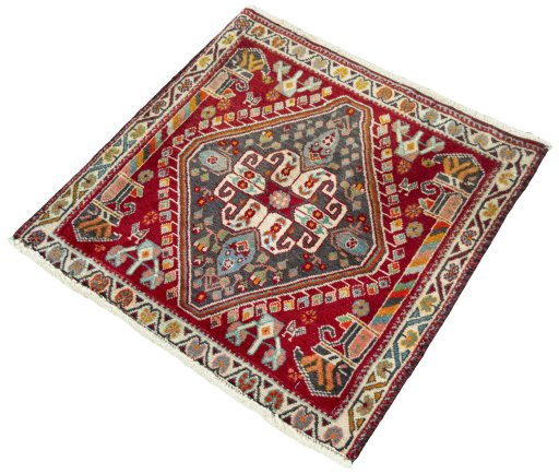 Corner detail of 2000s Shiraz rug showing border pattern and Wool pile