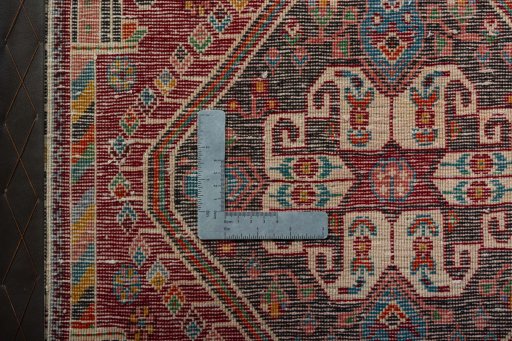 Backside of handmade 2000s Shiraz rug showing knot structure and weave density