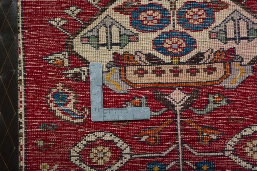 Backside of handmade 2000s Shiraz rug showing knot structure and weave density