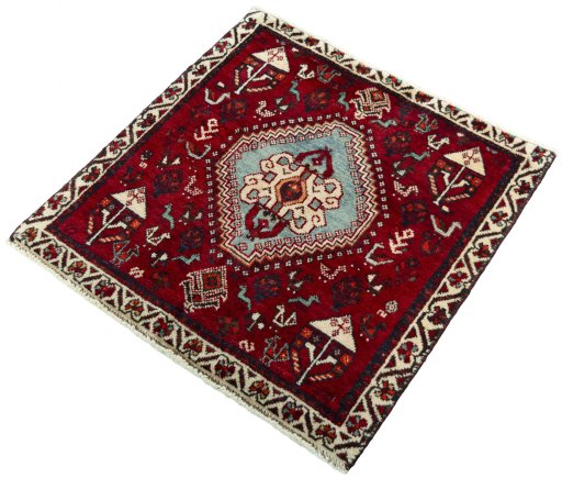 Corner detail of 2000s Shiraz rug showing border pattern and Wool pile