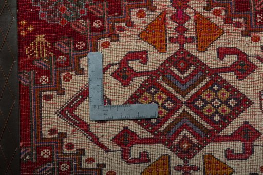 Backside of handmade 2000s Shiraz rug showing knot structure and weave density