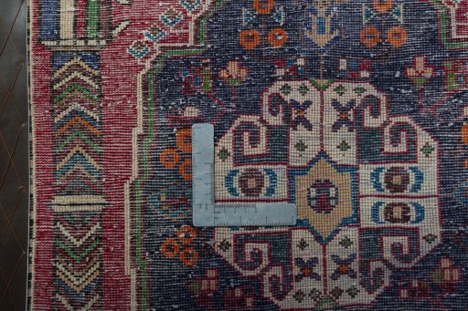 Backside of handmade 2000s Shiraz rug showing knot structure and weave density