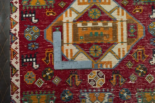 Backside of handmade 2000s Shiraz rug showing knot structure and weave density