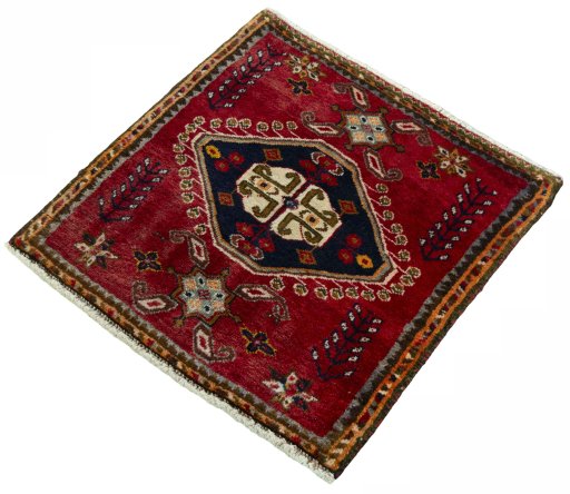 Corner detail of 2000s Shiraz rug showing border pattern and Wool pile