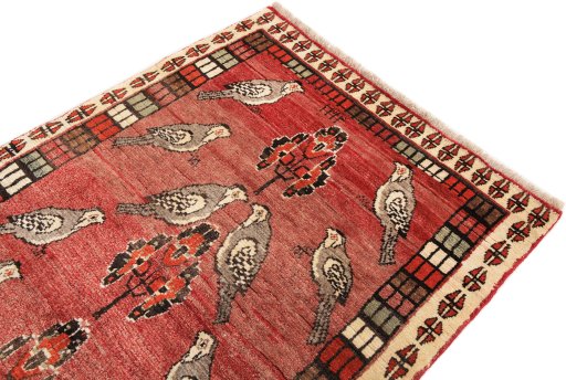 Surface texture of 2000s Shiraz rug with natural Wool and intricate pattern