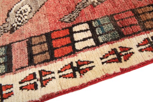 Backside of handmade 2000s Shiraz rug showing knot structure and weave density
