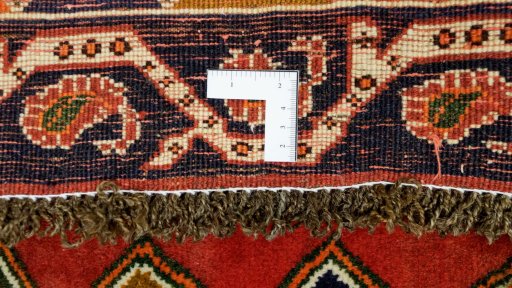 Full view of 1990s Shiraz rug from Iran / Persia, 140 × 115 cm in Red tones