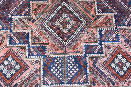 Backside of handmade 1970s Sirjan rug showing knot structure and weave density