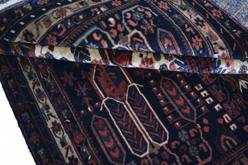 Corner detail of 2000s Sirjan rug showing border pattern and Wool pile