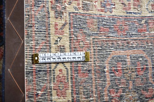 Surface texture of 2000s Sirjan rug with natural Wool and intricate pattern