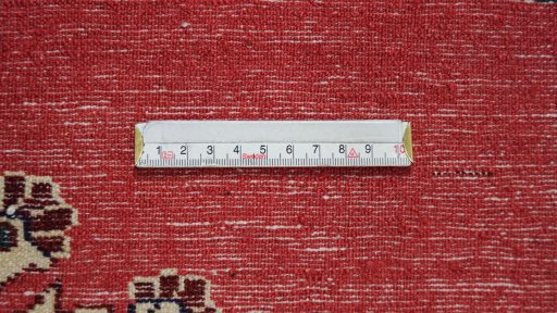 Backside of handmade 1950s Tafresh rug showing knot structure and weave density