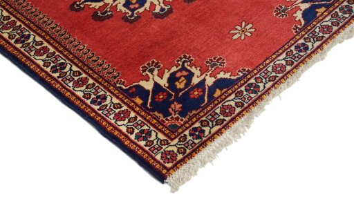 Surface texture of 1950s Tafresh rug with natural Wool and intricate pattern