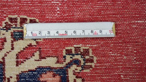 Backside of handmade 1950s Tafresh rug showing knot structure and weave density