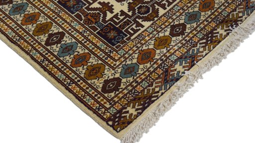 Surface texture of 1960s Torkaman rug with natural Wool and intricate pattern