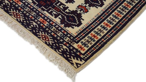 Surface texture of 1960s Torkaman rug with natural Wool and intricate pattern