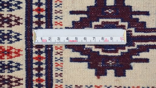 Backside of handmade 1960s Torkaman rug showing knot structure and weave density