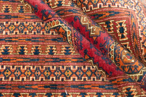 Full view of 1960s Torkaman rug from Uzbekistan, 200 × 114 cm in Dark red tones