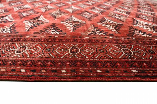 Corner detail of 2000s Torkaman rug showing border pattern and Wool pile