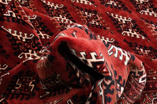 Surface texture of 2000s Torkaman rug with natural Wool and intricate pattern