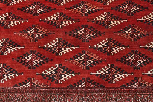 Backside of handmade 2000s Torkaman rug showing knot structure and weave density