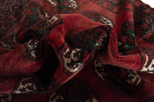 Corner detail of 2000s Torkaman rug showing border pattern and Wool pile