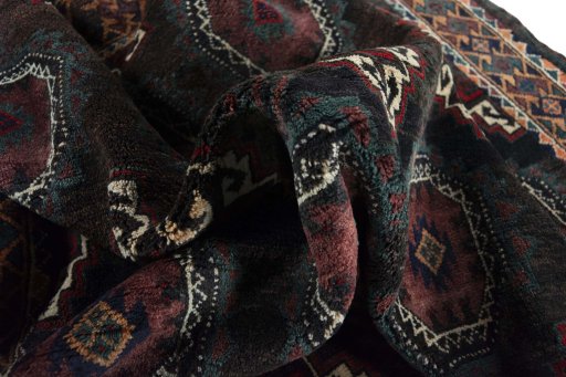Corner detail of 2000s Torkaman rug showing border pattern and Wool pile
