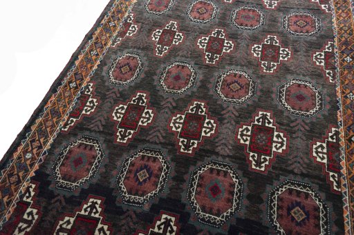 Backside of handmade 2000s Torkaman rug showing knot structure and weave density