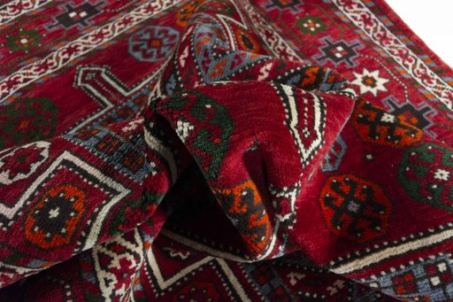 Corner detail of 2000s Torkaman rug showing border pattern and Wool pile
