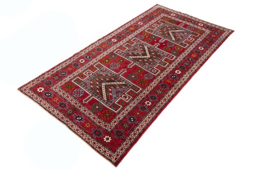 Corner detail of 2000s Torkaman rug showing border pattern and Wool pile