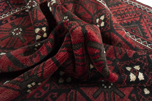 Corner detail of 2000s Torkaman rug showing border pattern and Wool pile