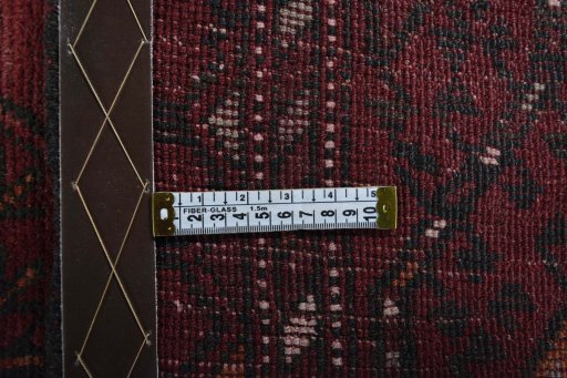 Corner detail of 2000s Torkaman rug showing border pattern and Wool pile
