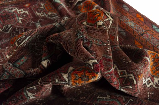 Corner detail of 2000s Torkaman rug showing border pattern and Wool pile