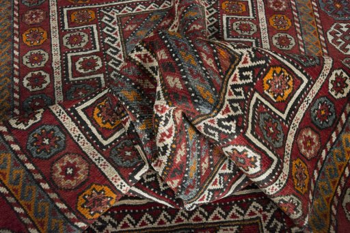 Corner detail of 2000s Torkaman rug showing border pattern and Wool pile