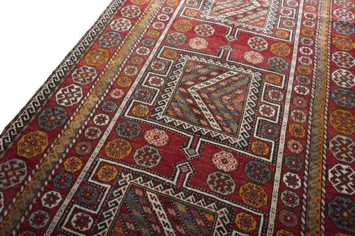 Backside of handmade 2000s Torkaman rug showing knot structure and weave density