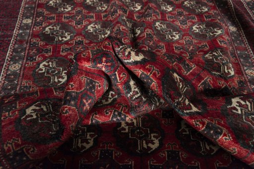 Corner detail of 1970s Torkaman rug showing border pattern and Wool pile