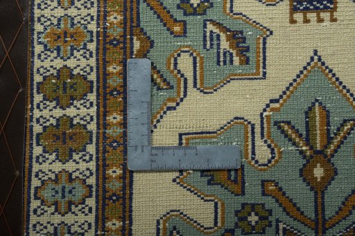 Corner detail of 2000s Torkaman rug showing border pattern and Wool pile