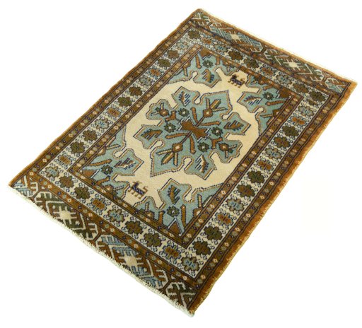 Corner detail of 2000s Torkaman rug showing border pattern and Wool pile