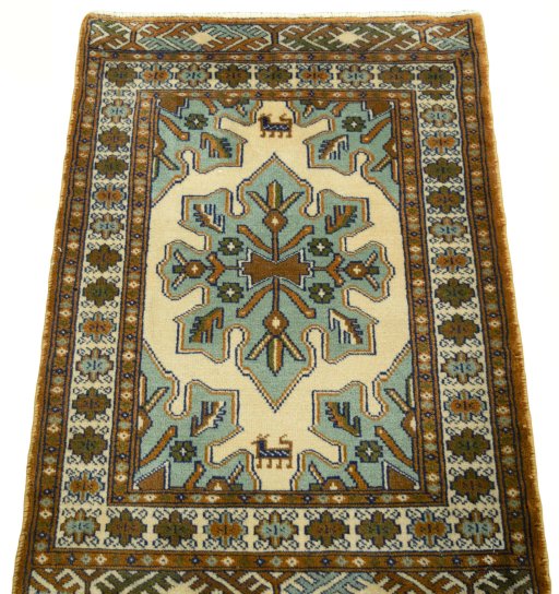 Surface texture of 2000s Torkaman rug with natural Wool and intricate pattern