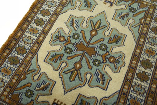 Backside of handmade 2000s Torkaman rug showing knot structure and weave density