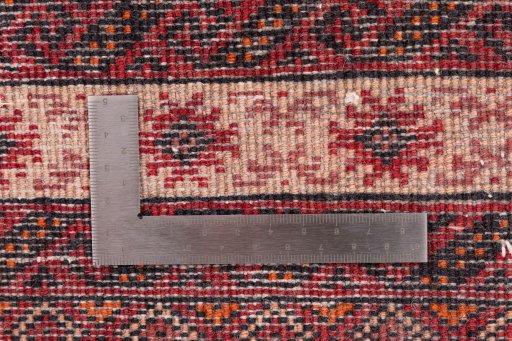 Corner detail of 1995s Torkaman rug showing border pattern and Wool pile