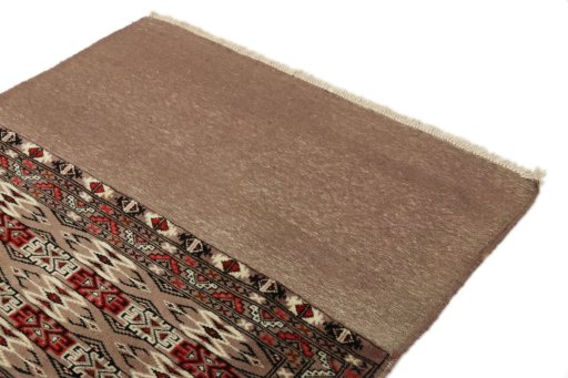 Surface texture of 2000s Torkaman rug with natural Wool and intricate pattern